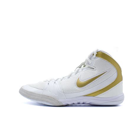 nike freeks gold and white.